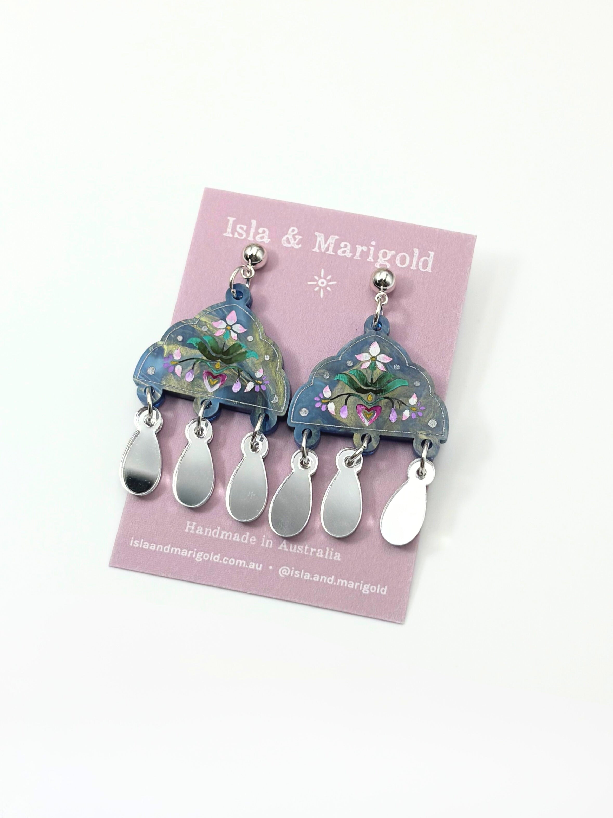 Earrings on a 'Isla & Marigold' branded card with a white background