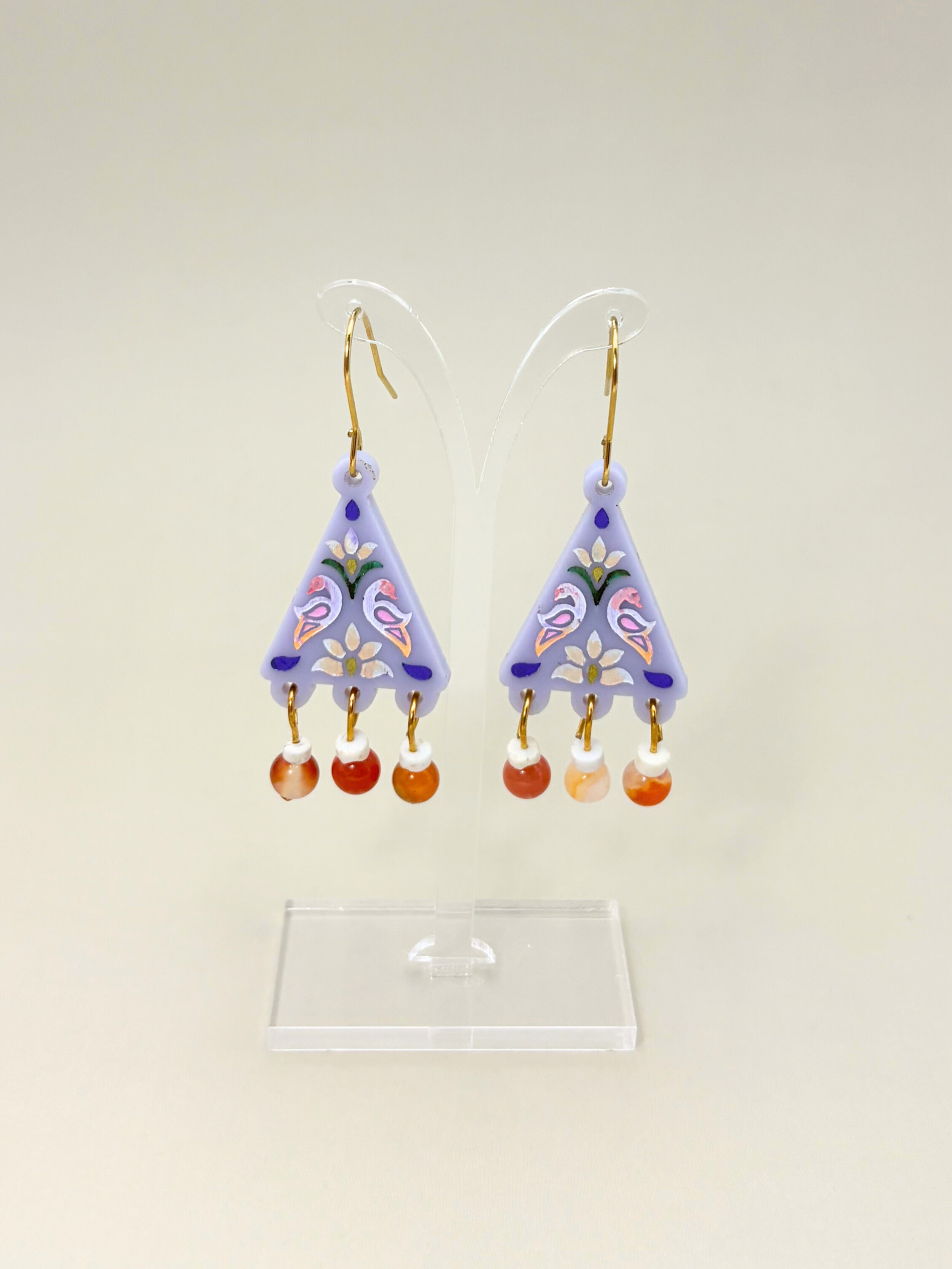 Pair of colorful earrings on a white background