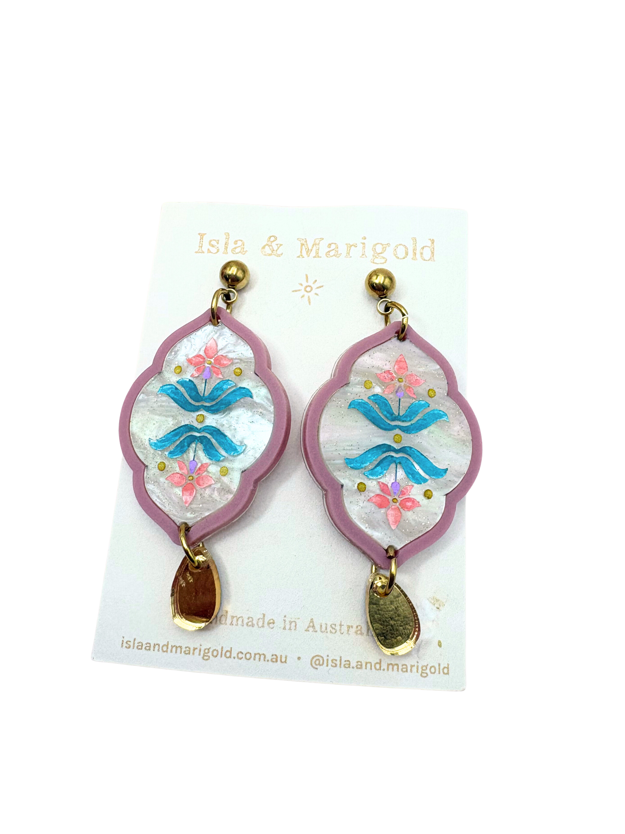 Pair of earrings with floral design on a white background